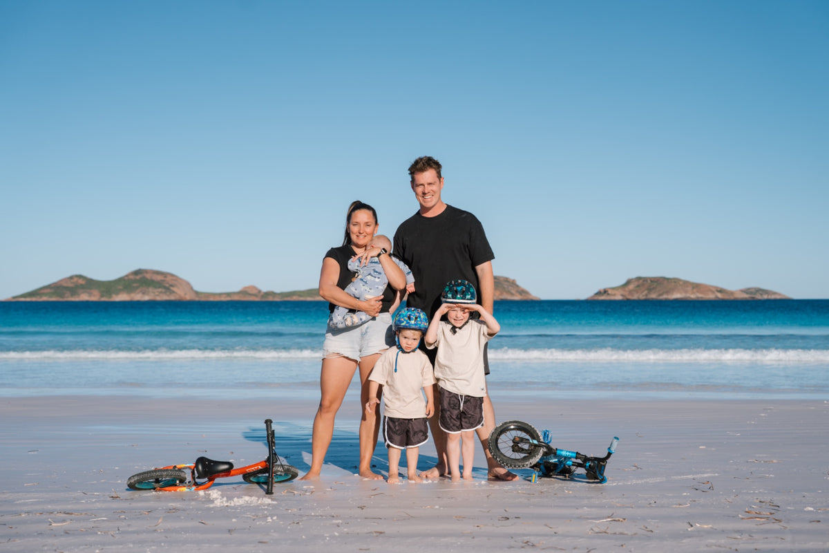 Mike, Elisha and their three boys on an Australian beach