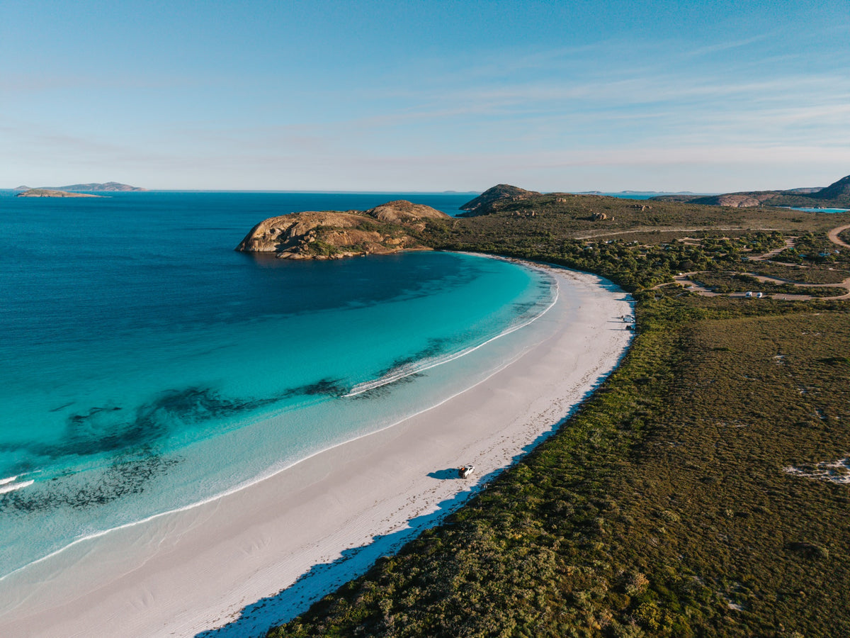 RAM parked beside turquoise water and white sand in Western Australia
